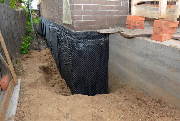 Happy homeowners after waterproofing job in Valparaiso